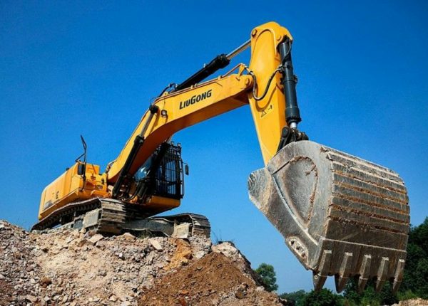 Excavator digging - 15 cubic yard dumpster projects
